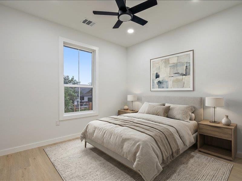 This room features a window providing natural light, a ceiling fan, and recessed lighting