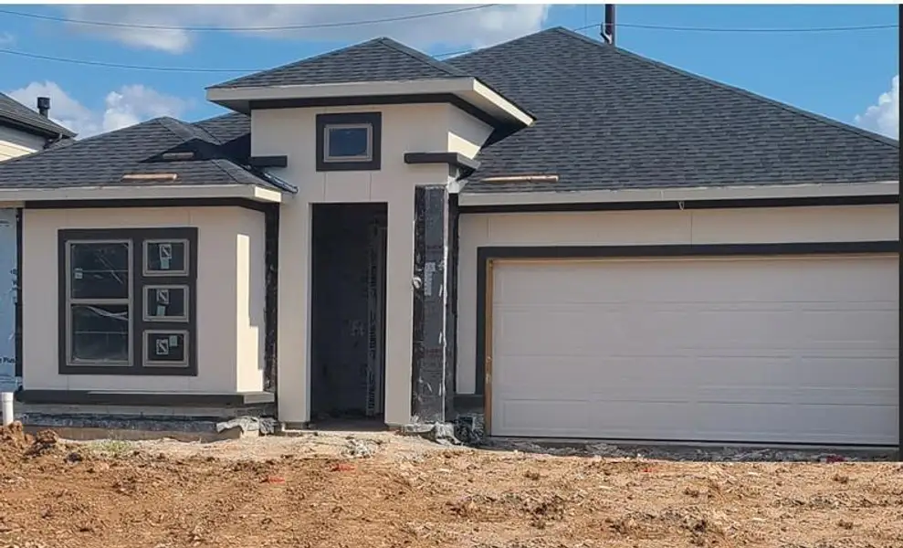 Front exterior of a new home in Harvest Green - Final Opportunities, Richmond, TX, highlighting curb appeal (Image 1). Front exterior of a new home in Harvest Green - Final Opportunities, Richmond, TX, highlighting curb appeal (Image 1).