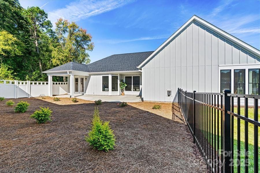 Exterior details and patio area of a home in The Courtyards at Lake Davidson, Mooresville (Image 26).