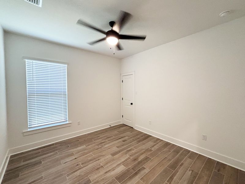 Spacious, unfurnished interior of a new home in Bird Song at Hammock Bay, Freeport (Image 25).