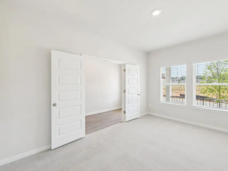 Spacious, unfurnished interior of a new home in Vines at Mill Creek - Estate Series, Braselton (Image 14).