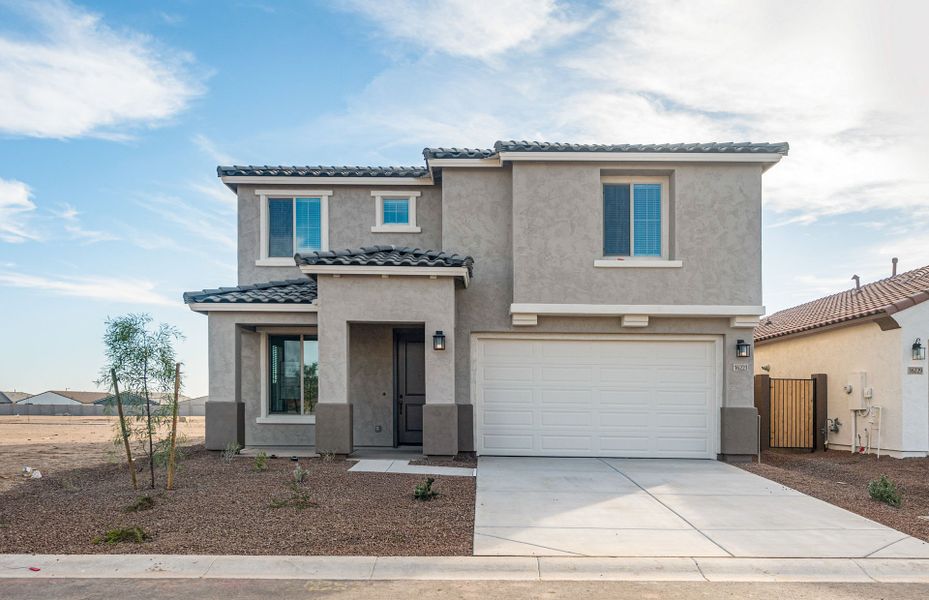 Front exterior of a new home in Visara, Surprise, AZ, highlighting curb appeal (Image 2). Front exterior of a new home in Visara, Surprise, AZ, highlighting curb appeal (Image 2).