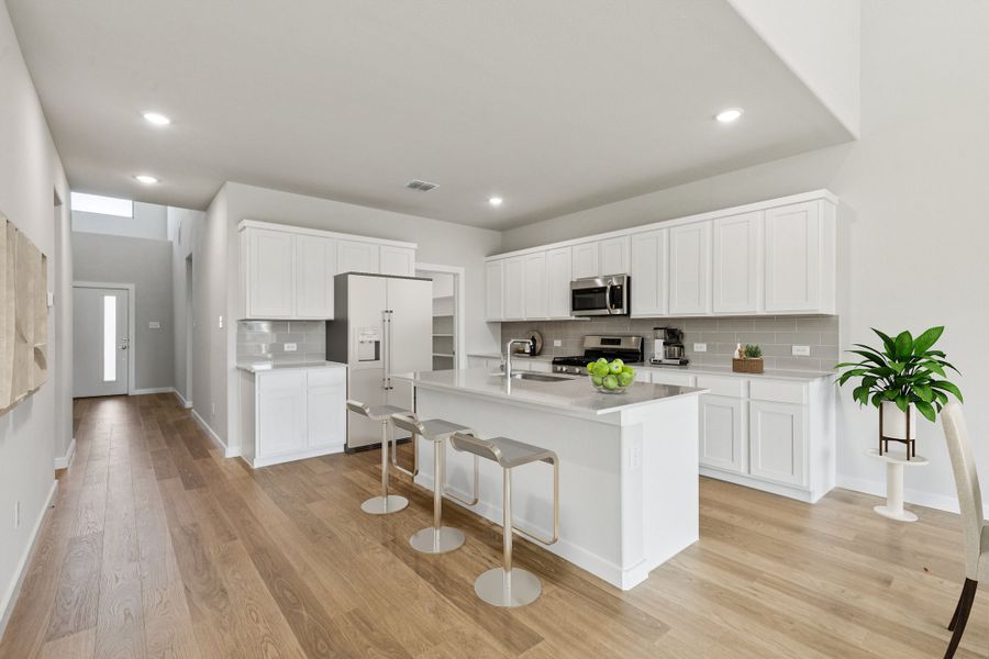 Kitchen in the Winters home plan by Trophy Signature Homes – REPRESENTATIVE PHOTO Kitchen in the Winters home plan by Trophy Signature Homes – REPRESENTATIVE PHOTO