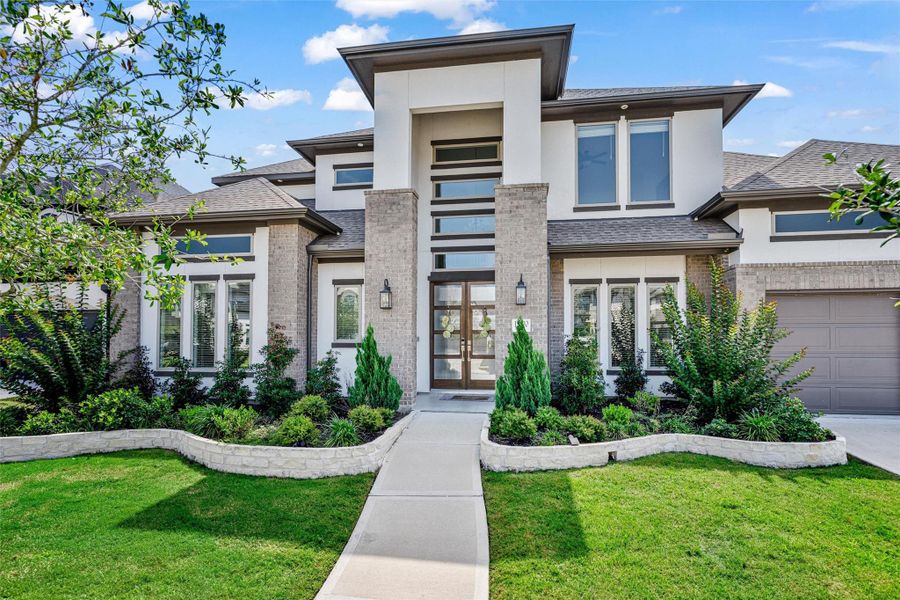 Front exterior of a new home in Dunham Pointe, Cypress, TX, highlighting curb appeal (Image 20).