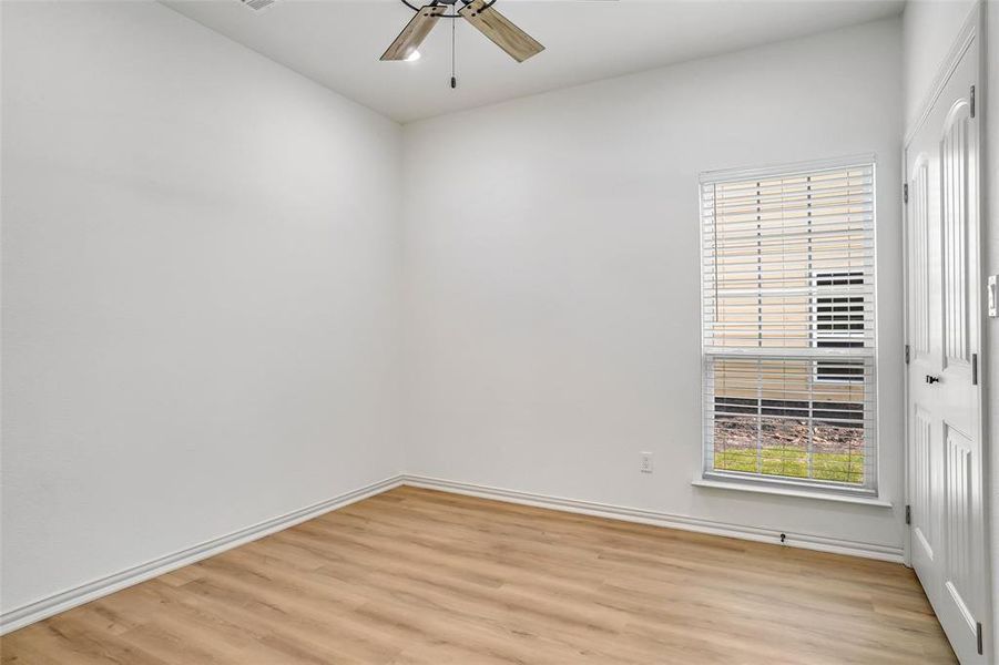 Spare room with ceiling fan and light hardwood / wood-style flooring