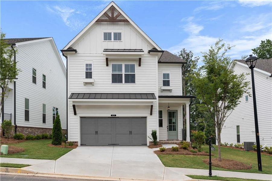 Front exterior of a new home in Palisades Single Family, Cumming, GA, highlighting curb appeal (Image 27).