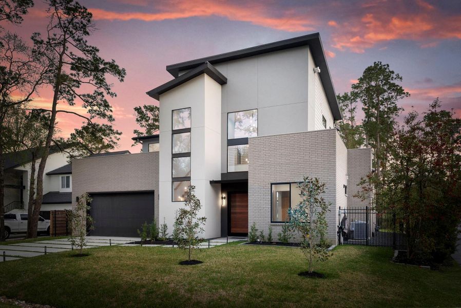 Front exterior of a new home in , The Woodlands, TX, highlighting curb appeal (Image 2).