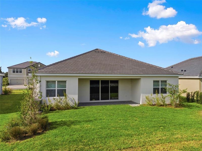 Exterior details and patio area of a home in Tamarack at Two Rivers, Zephyrhills (Image 36).