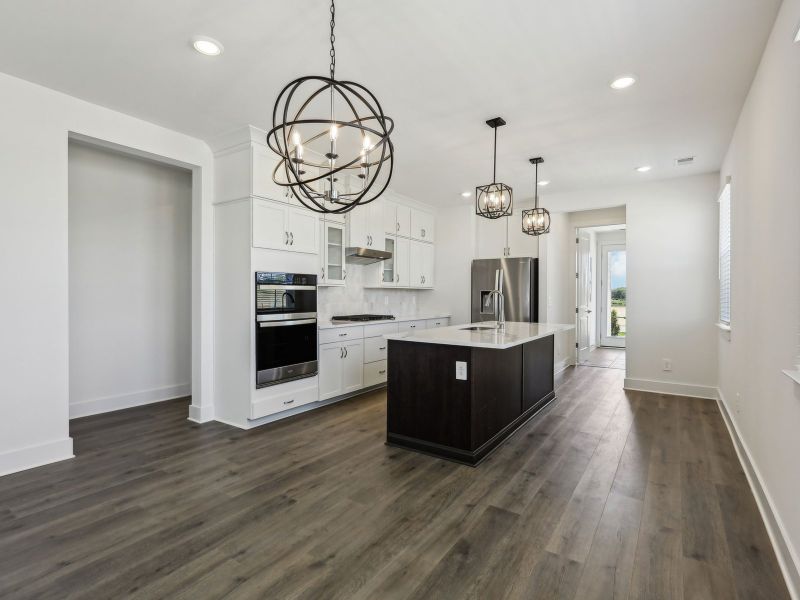 The open-concept floorplan allows for an easy flow between the kitchen and dining areas. The open-concept floorplan allows for an easy flow between the kitchen and dining areas.