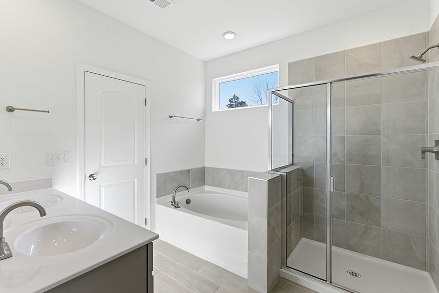 A bathroom with a glass shower.