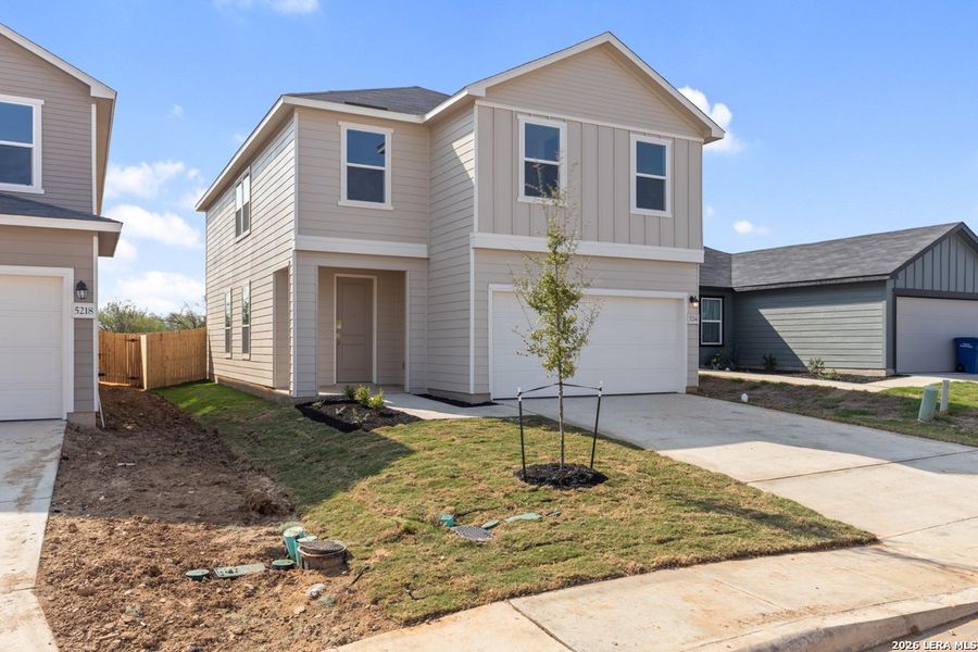 Front exterior of a new home in Southton Cove, San Antonio, TX, highlighting curb appeal (Image 18).