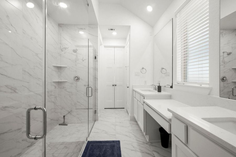 Primary bathroom with a Primary bathroom with a