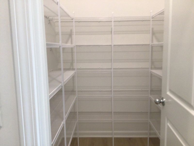 Pantry featuring the AW Collection® Coastal - Glass-front storage with ocean tones.