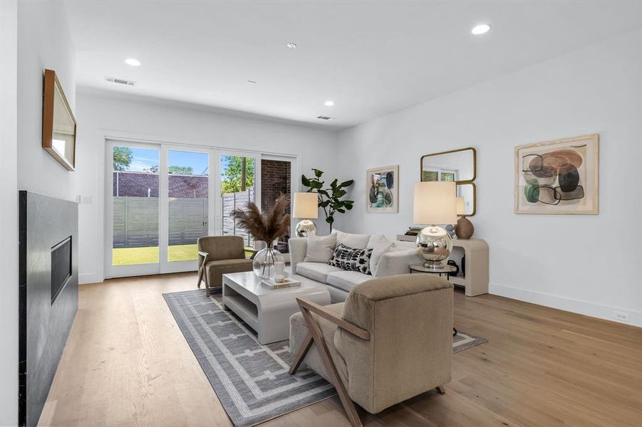 Living room with light wood-type flooring