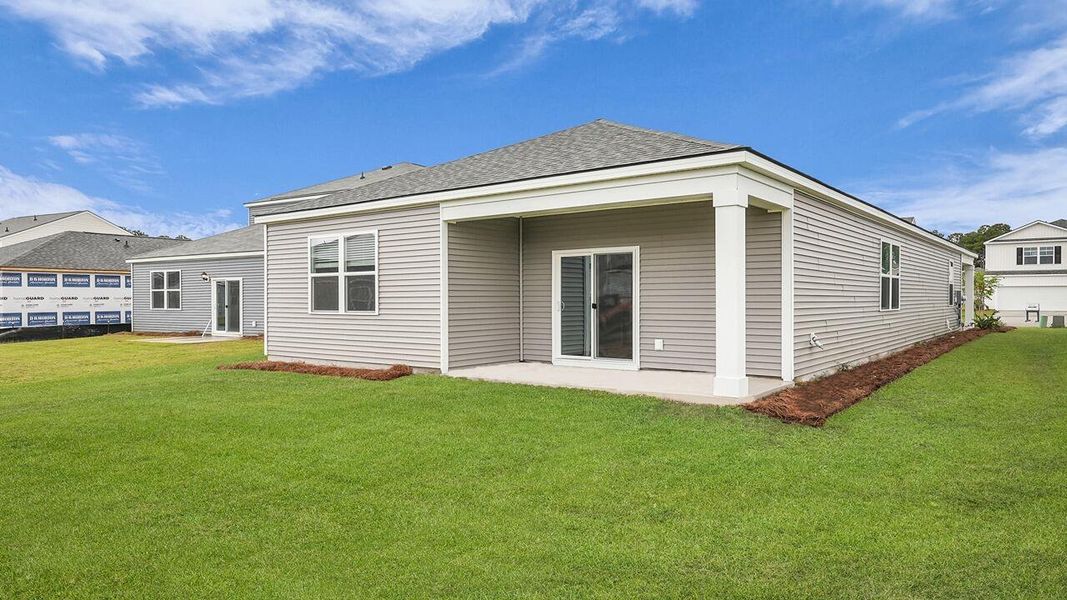 Exterior details and patio area of a home in Pine Hills at Cane Bay, Summerville (Image 19).