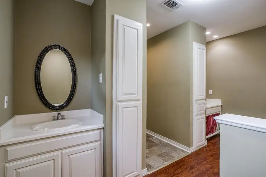 Dual sinks and vanities in the primary bathroom Dual sinks and vanities in the primary bathroom