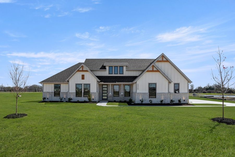 Front exterior of a new home in Estates of Palmer, Waxahachie, TX, highlighting curb appeal (Image 1). Front exterior of a new home in Estates of Palmer, Waxahachie, TX, highlighting curb appeal (Image 1).