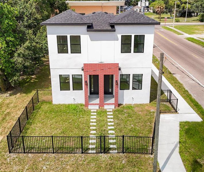 Front exterior of a new home in , Tampa, FL, highlighting curb appeal (Image 1).