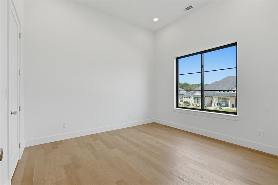 Bright interior space with light wood-finish flooring