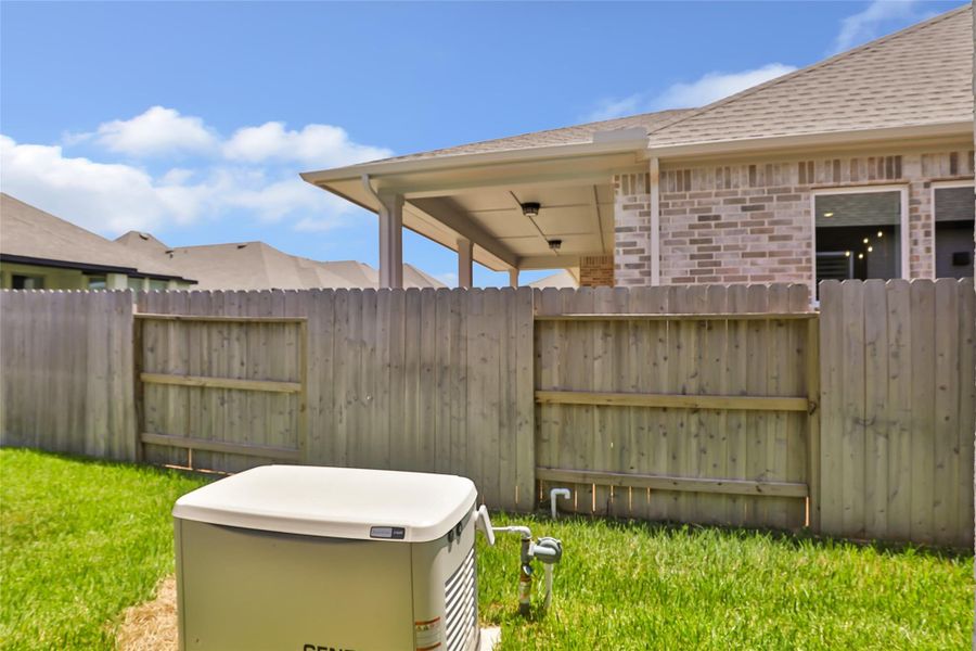 Exterior details and patio area of a home in Grand Central Park, Conroe (Image 30).