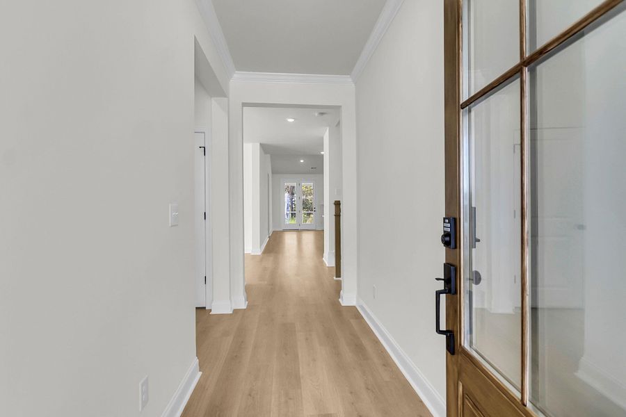 Spacious, unfurnished interior of a new home in Tidewater at Lakes of Cane Bay, Summerville (Image 24).