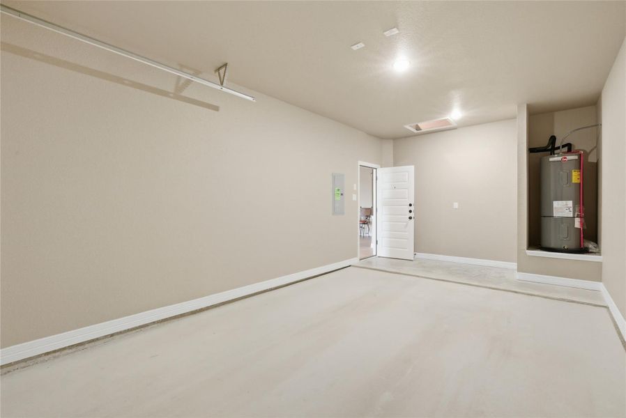 Garage with electric water heater and electric panel