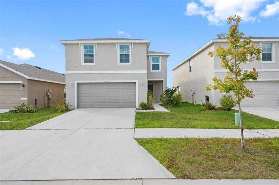 Front exterior of a new home in , Ruskin, FL, highlighting curb appeal (Image 22). Front exterior of a new home in , Ruskin, FL, highlighting curb appeal (Image 22).