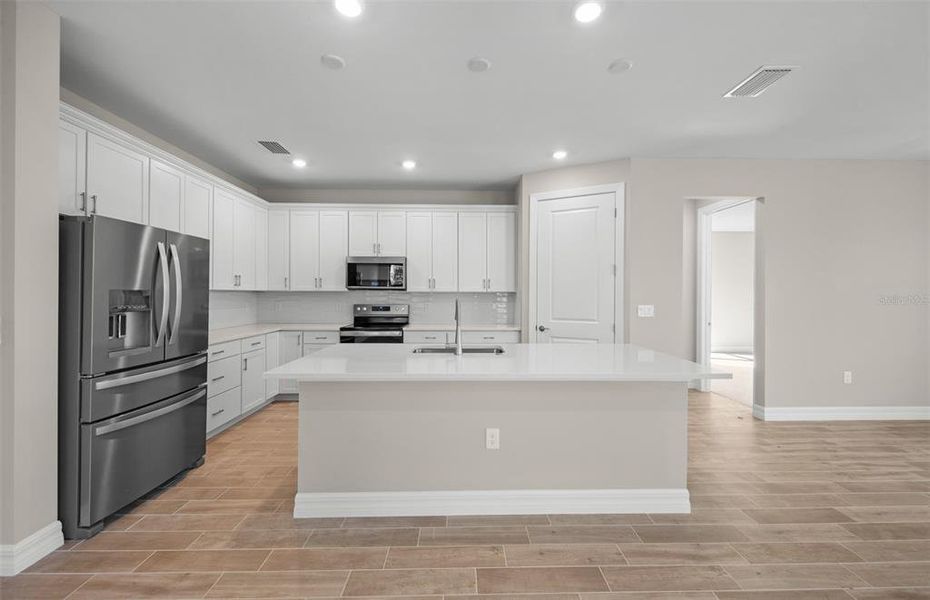 Furnished interior view inside a new home in Cedar Grove at The Woodlands, North Port (Image 11).