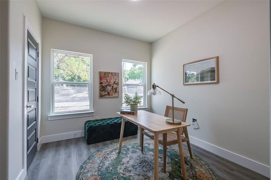 Office with hardwood / wood-style floors