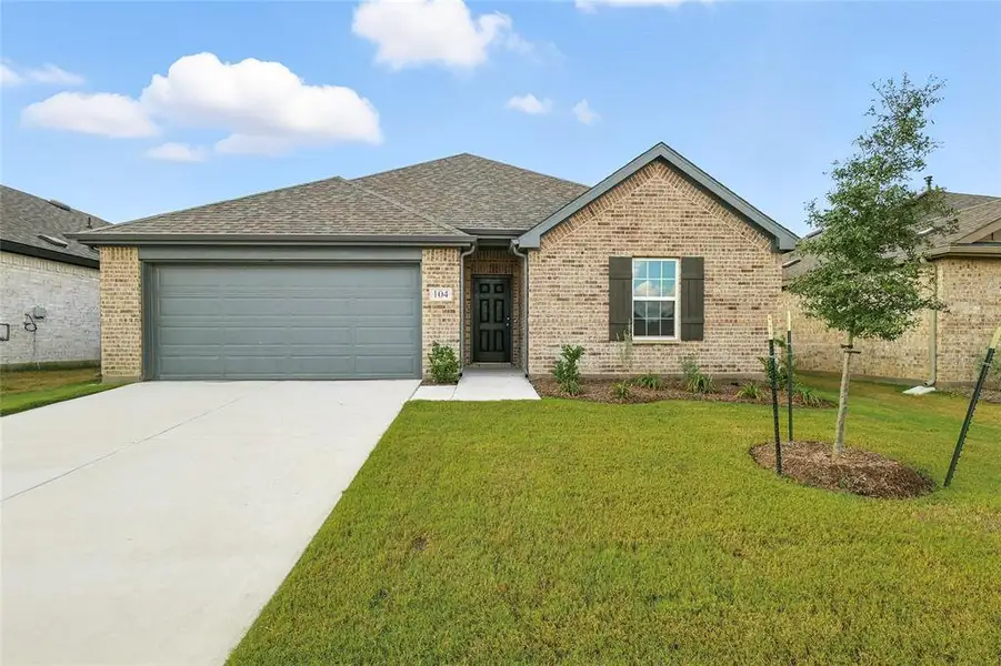 Single story home featuring a shingled roof, brick siding, concrete driveway, a front lawn, and an attached garage Single story home featuring a shingled roof, brick siding, concrete driveway, a front lawn, and an attached garage
