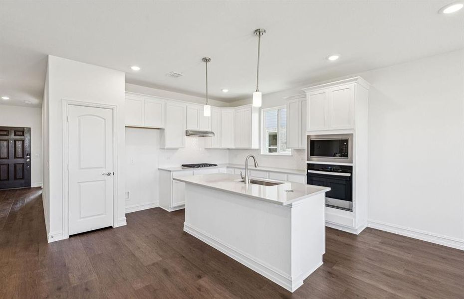 Spacious kitchen with eat-in bartop island Spacious kitchen with eat-in bartop island