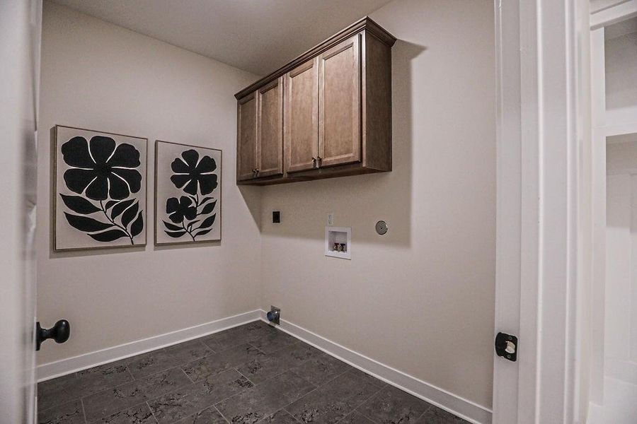 Laundry room featuring cabinet space, washer hookup, and hookup for an electric dryer