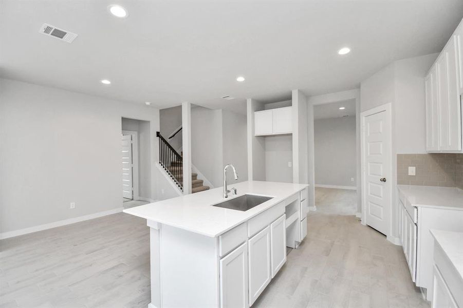 The kitchen is a culinary haven, featuring granite countertops, a tile backsplash, stainless steel appliances (To be Installed) and 42” upper cabinets.