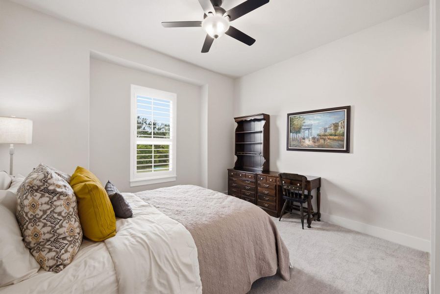 On the other side of the shared bath, the third guest room offers a cozy, quiet retreat with plenty of closet space, making it an ideal setup for siblings or long-term guests