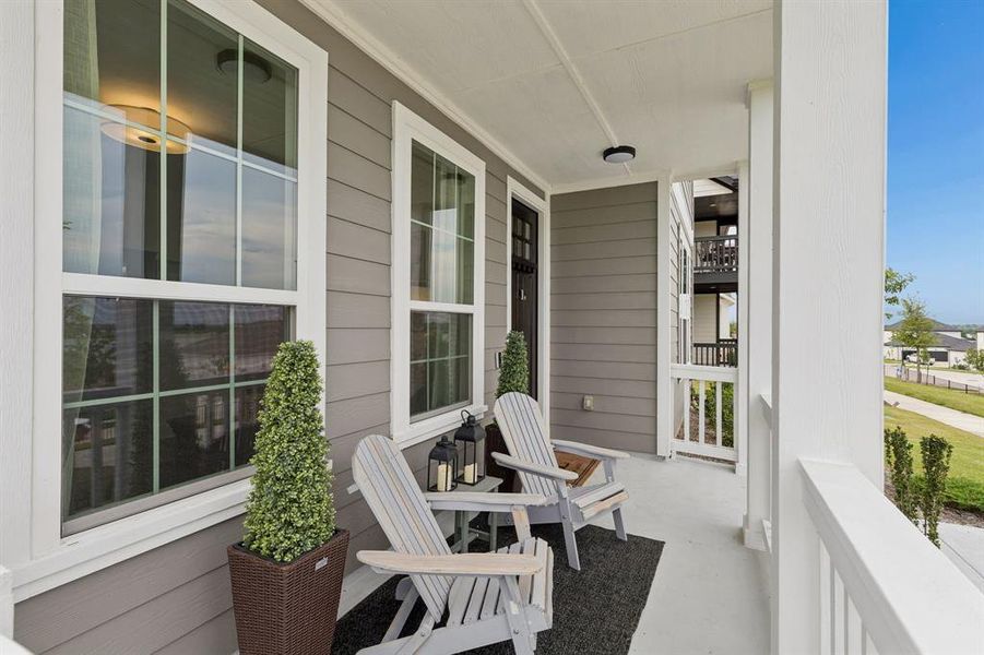Enjoy morning coffee, evening conversations, or peaceful lake breezes from the spacious covered front porch overlooking the neighborhood streetscape.