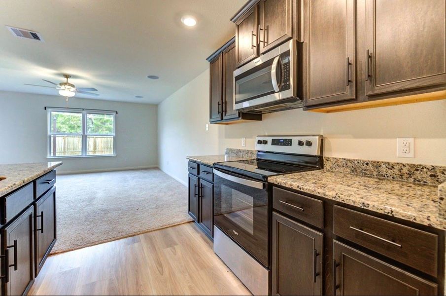 Furnished interior view inside a new home in Williams Trace, Magnolia (Image 9).