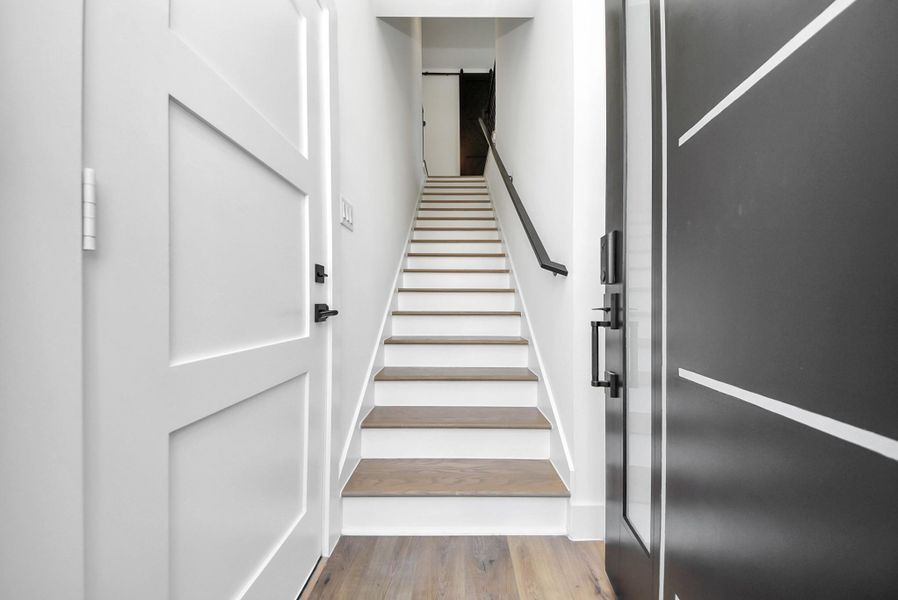 Stairs to main unit, mother in law suite to the right, garage to the left