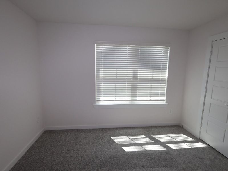 Spacious, unfurnished interior of a new home in Pinewood at Grand Texas, New Caney (Image 14).