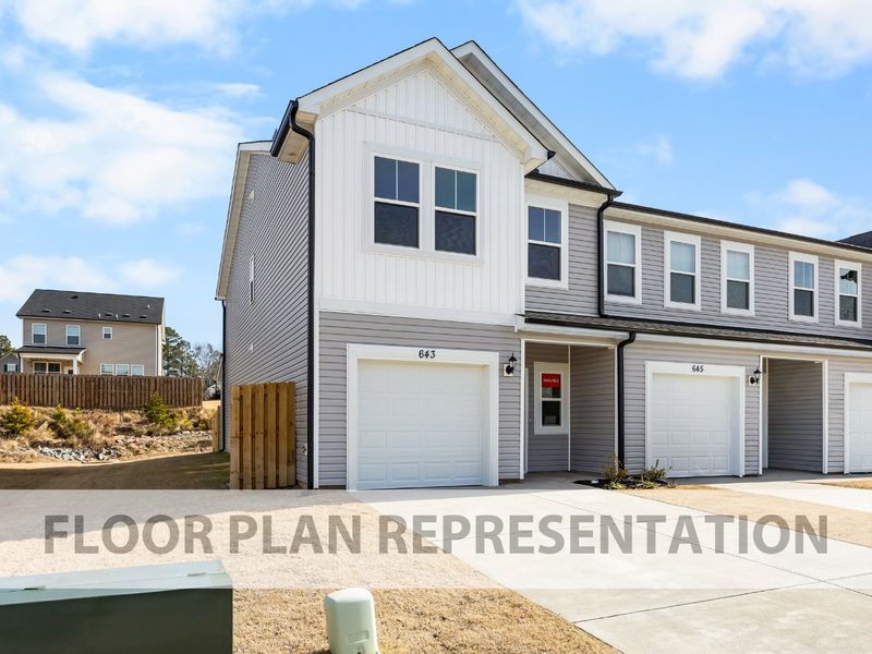 Front exterior of a new home in Caroleton Townhomes, Grovetown, GA, highlighting curb appeal (Image 1). Front exterior of a new home in Caroleton Townhomes, Grovetown, GA, highlighting curb appeal (Image 1).