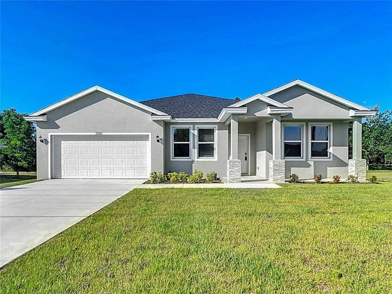 Front exterior of a new home in , Homosassa, FL, highlighting curb appeal (Image 1). Front exterior of a new home in , Homosassa, FL, highlighting curb appeal (Image 1).