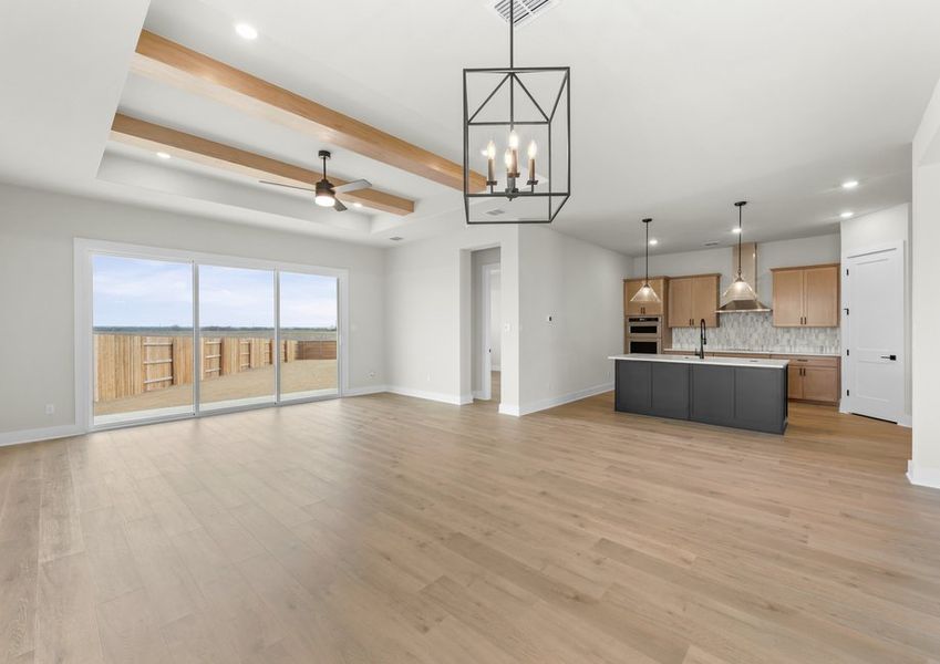 The open layout connects the kitchen, dining area and living room.