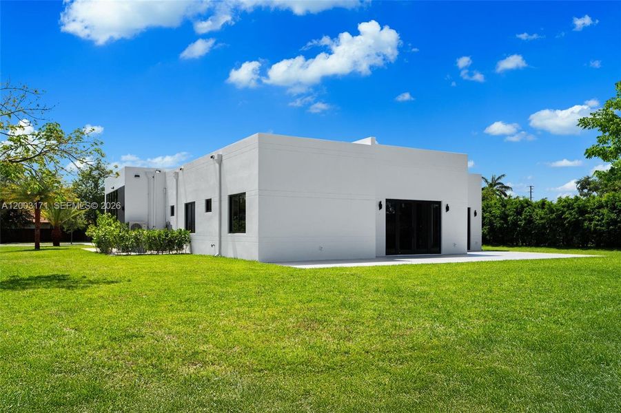 Front exterior of a new home in , Homestead, FL, highlighting curb appeal (Image 18).