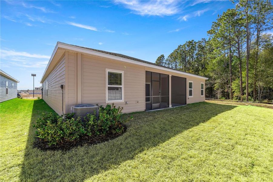 Exterior details and patio area of a home in Trailhead Landing, Alachua (Image 3).