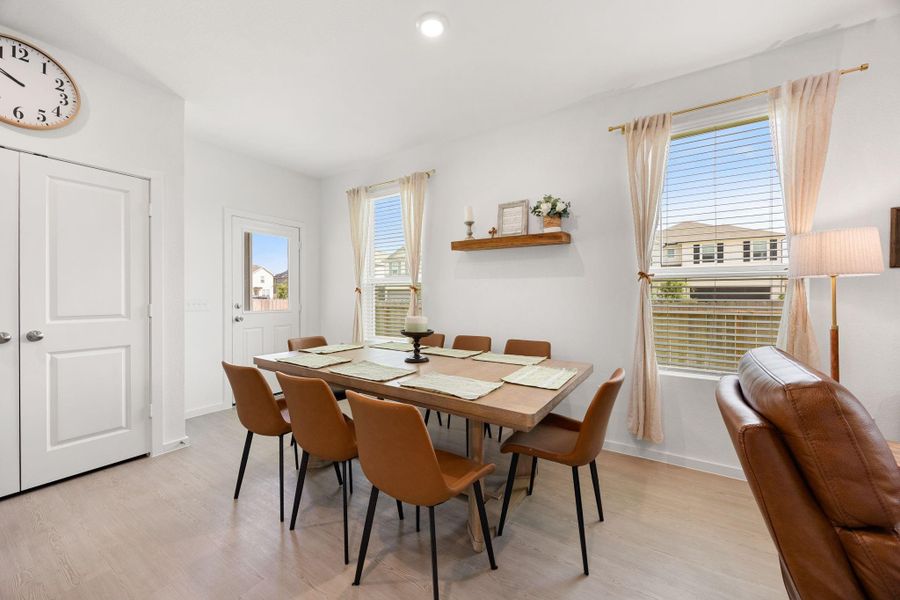 The dedicated dining area easily accommodates a large table and is surrounded by natural light, making family dinners and holiday gatherings feel even more inviting.