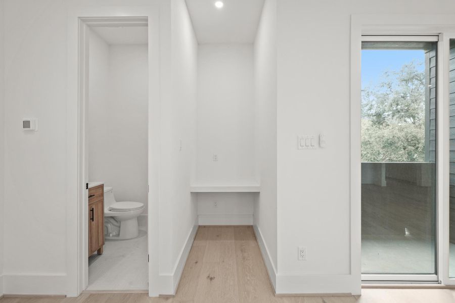 To the left of the family and dining area is the half bath and a nook with recessed lighting offering the perfect set up for a private desk area.