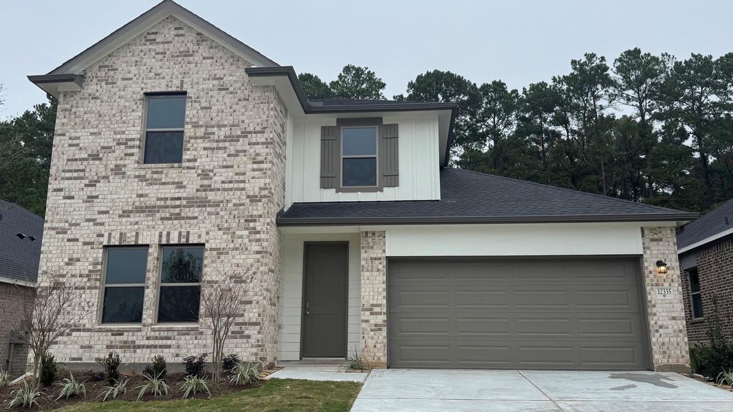 Front exterior of a new home in Westridge Cove, Conroe, TX, highlighting curb appeal (Image 6).
