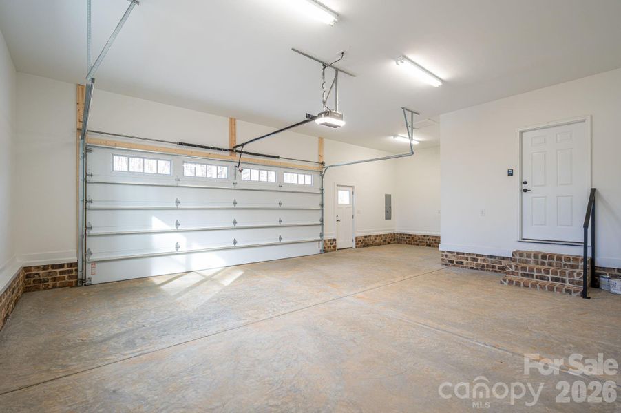 Additional space in garage for storage and entrance to home.