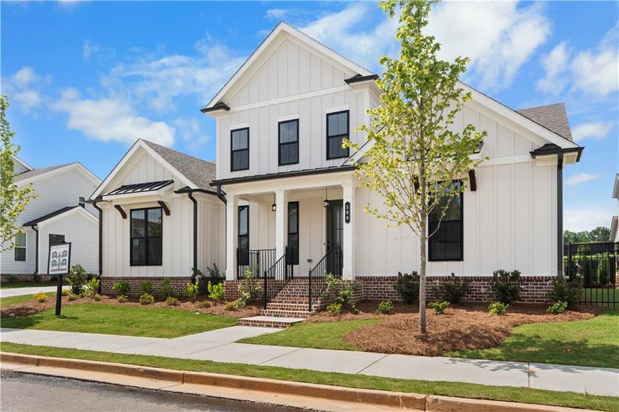 Front exterior of a new home in Promenade at Sawnee Village, Cumming, GA, highlighting curb appeal (Image 22).