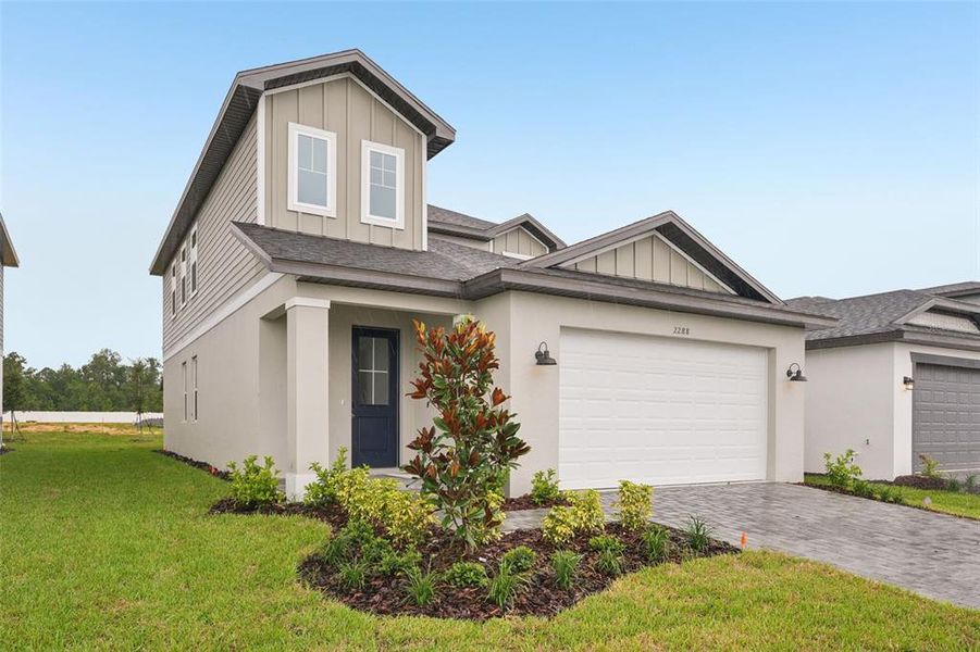 Front exterior of a new home in Cyrene at Minneola, Minneola, FL, highlighting curb appeal (Image 2).