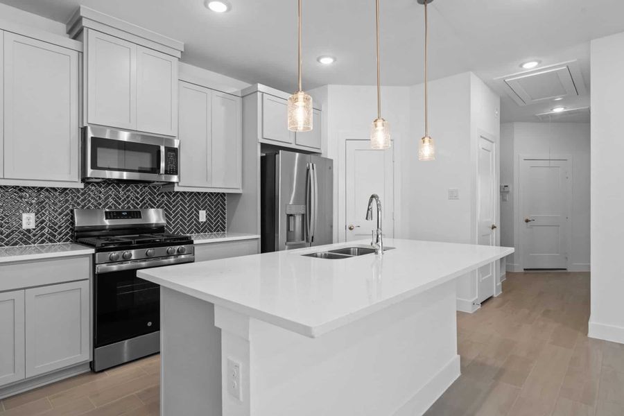 Furnished interior view inside a new home in Meridiana, Iowa Colony (Image 6).
